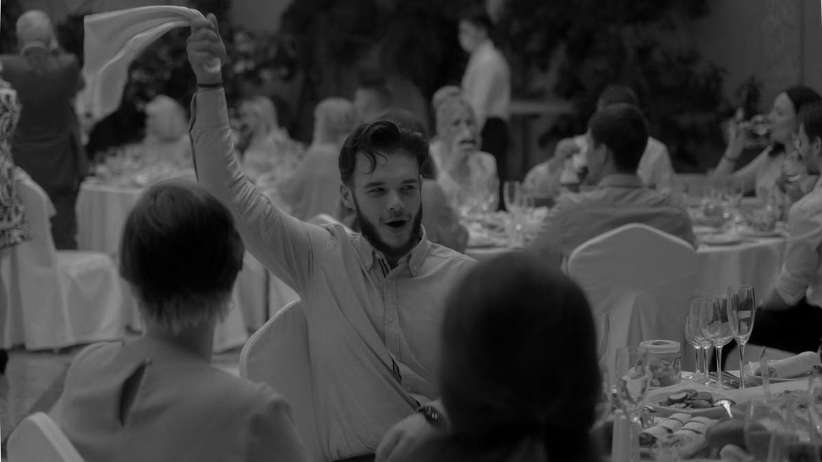 A lively moment captured during a formal dinner event with people celebrating and enjoying the occasion.